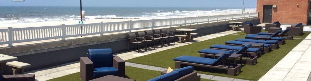 Commercial artificial grass patio next to beach