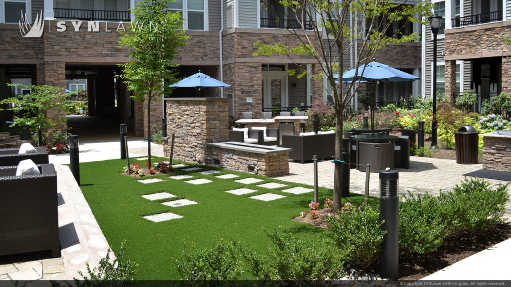 Outdoor artificial grass lounge area