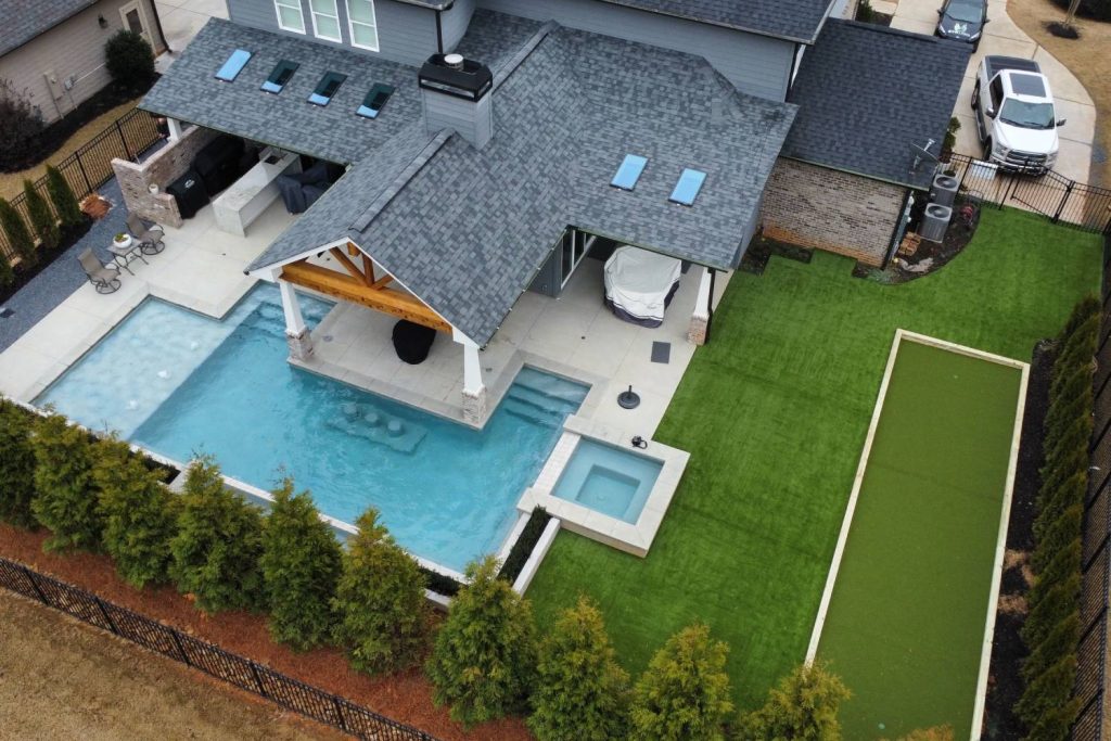 Artificial grass backyard with pool