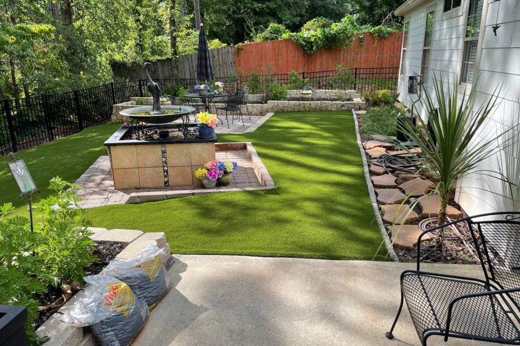 Artificial grass backyard patio